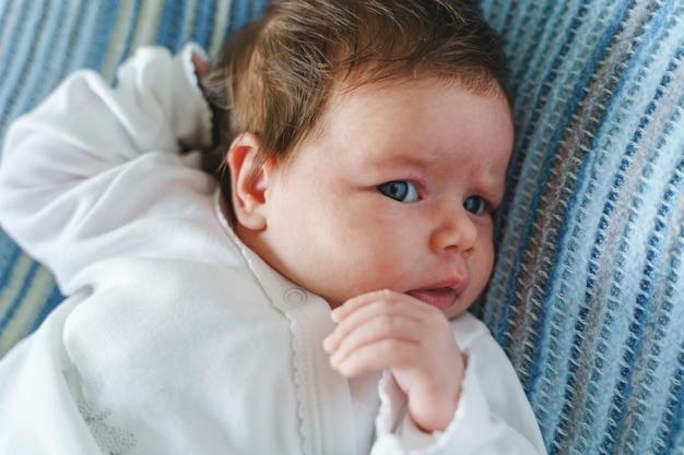 Close-up of cute baby boy sleeping on bed at home