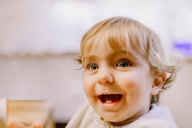 Close-up of cute cheerful girl looking away