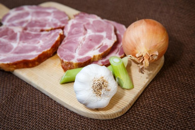 Close up of a cutting board with smoked pork