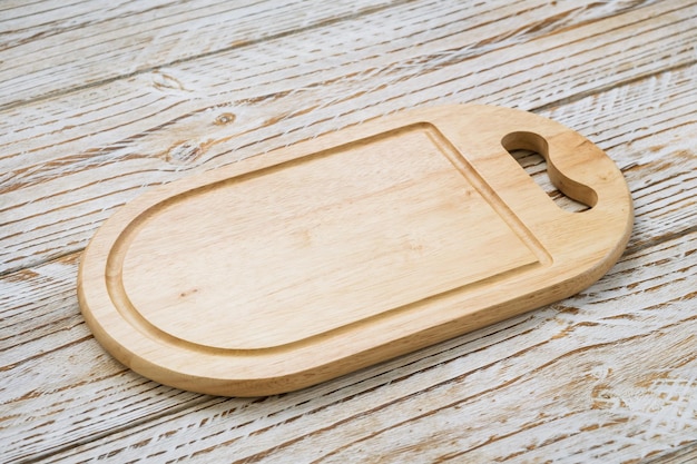 Close-up of cutting board on wooden table