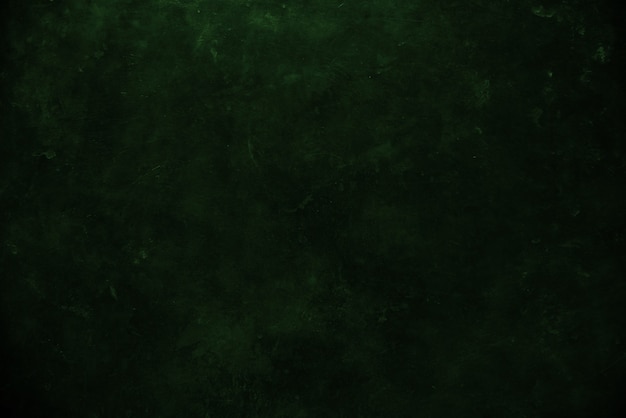 Close up on dark green grunge wall background or texture