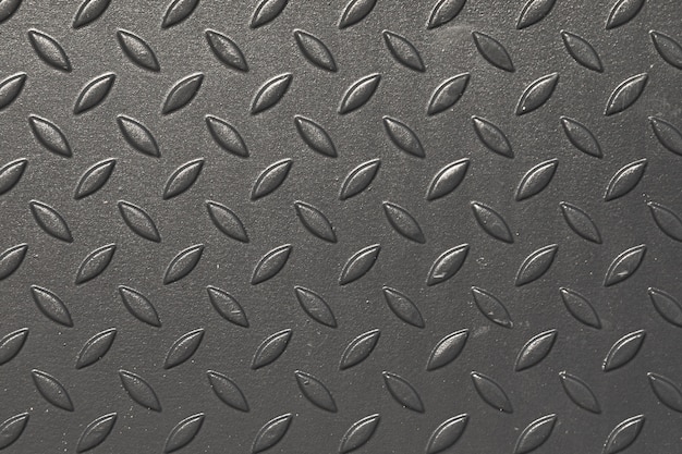 Photo close-up of dark grey tactile surface in the daylight