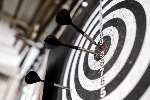 Photo close up of dart board in a pub