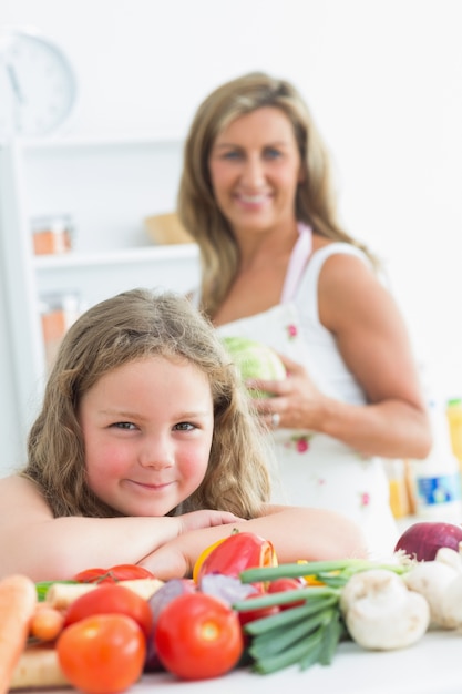 Close up of daughter leaning on table 