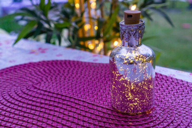 Close-up of decorated bottle on table