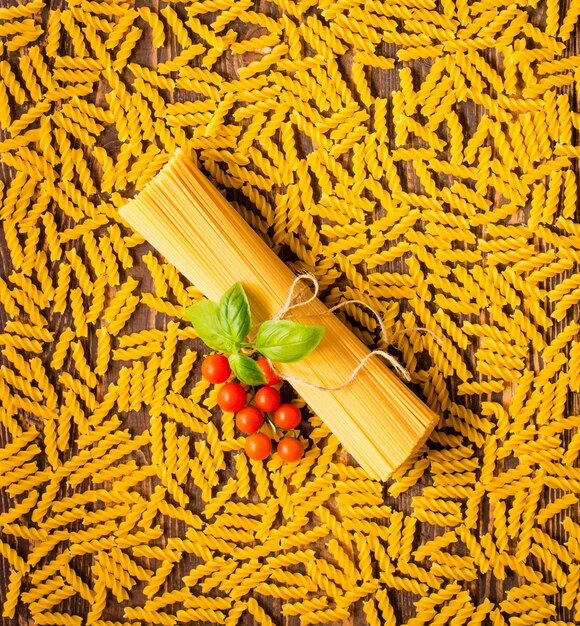 Close-up of decorating Italian pasta. On a wooden table