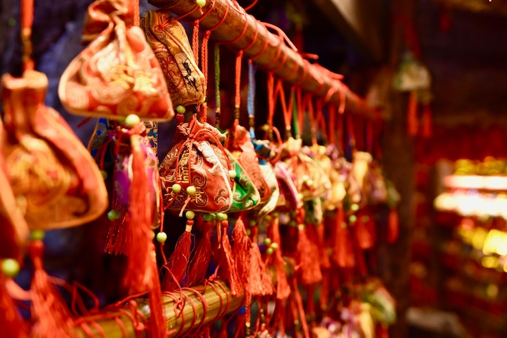 Photo close-up of decorations hanging for sale in market