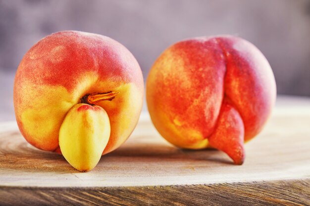 Close up on deformed and imperfect peaches