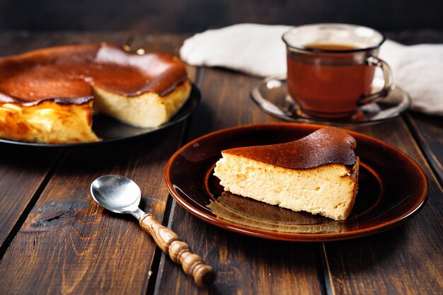 Close up of delicious basque burnt cheesecake on rustic table