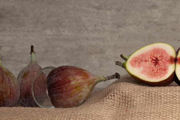 Close up of delicious figs on jute.