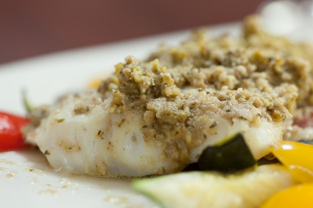 Close up of delicious fish dish with pesto