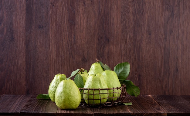 Close up of delicious guava with fresh green leaves