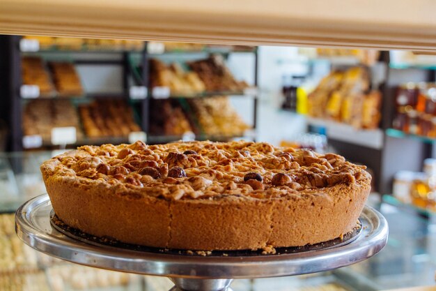 Close-up of delicious large pastry or cake on display in a local bakery
