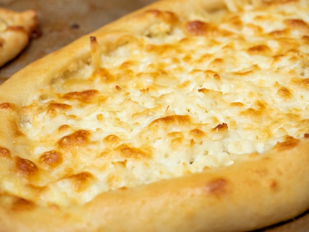 Close-up of delicious ready-made khachapuri. Side view