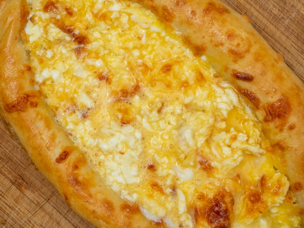 Close-up of delicious ready-made khachapuri. top view, flat lay
