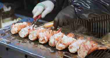 Photo close up of delicious shrimp skewer kuromon market osaka japan asia