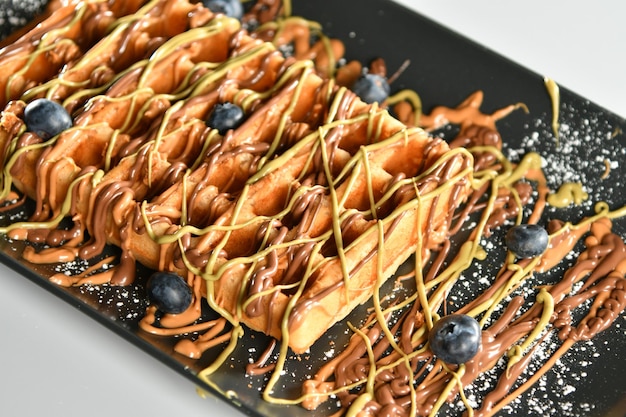 Close-up of a delicious waffle dish with chocolate, oriental sweets , Ramadan ,  sugars, delicious