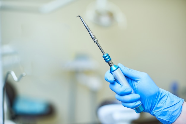 Close-up of dentist's hands and dental equipment