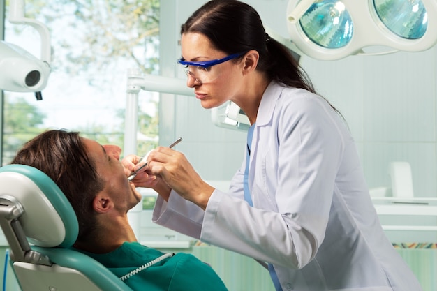 Close-up of a Dentist Working on Patient