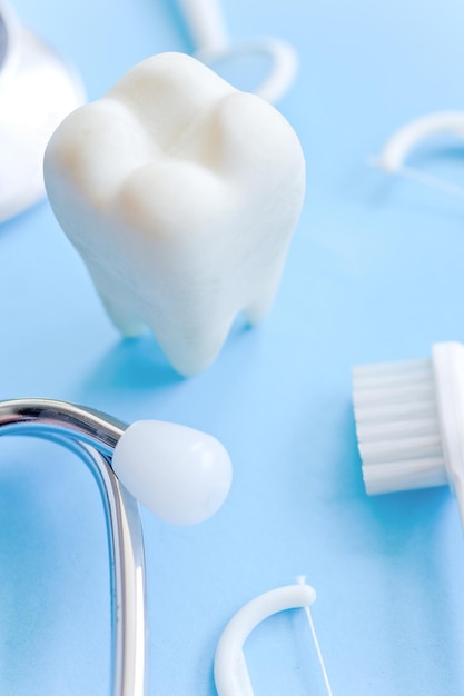 Photo close-up of dentures and stethoscope on table