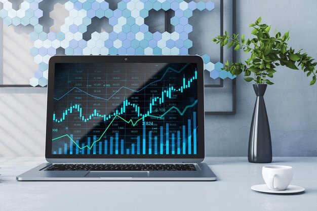 Close up of desktop with laptop and glowing business chart\
hologram and index on screen blurry office background with coffee\
cup plant and picture finance trade and invest concept 3d\
rendering