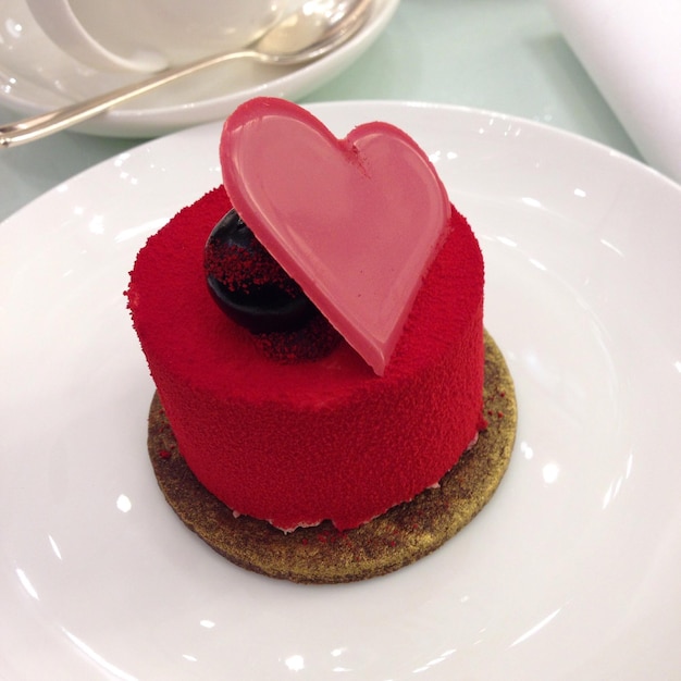 close-up of dessert with heart shape served in plate