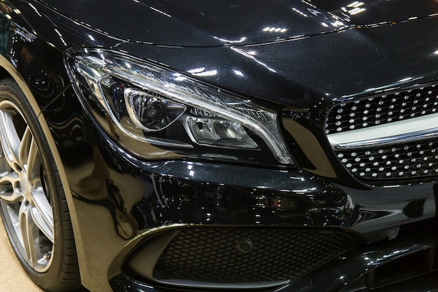 Close up of detail on one of the LED headlights modern and luxury car. Select focus.