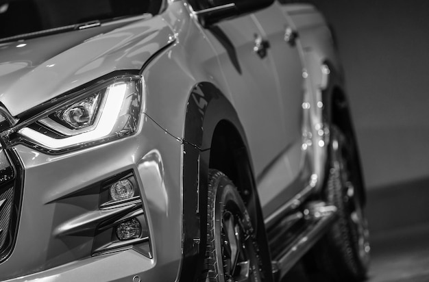 Close up detail on one of the LED headlights Pickup Truck on black background