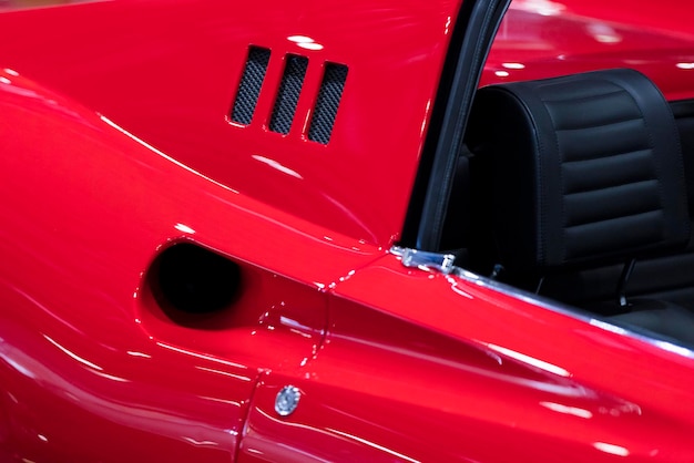 Close up detail on a red vintage sports car