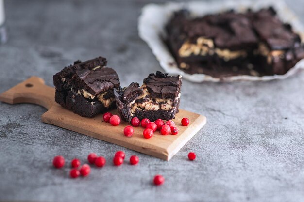 Close up detail view of molten white chocolate brownie and currant