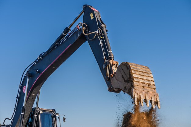 Foto close-up details van een industriële graafmachine die op bouwplaats 3 werkt