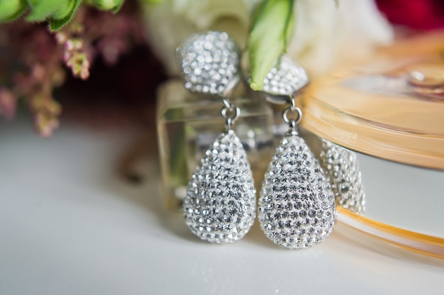 Close up of diamond earrings. close up, space for your\
text