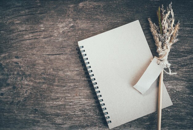 Close-up of diary and decor on wooden table