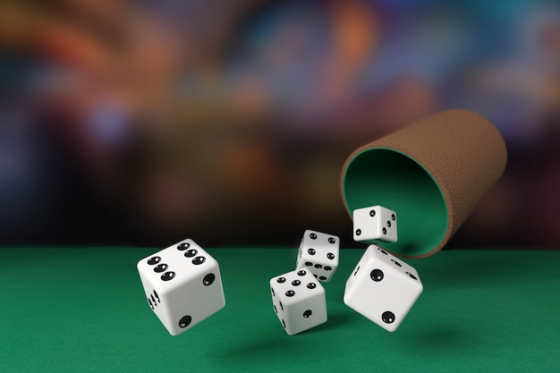 Close-up of dice rolling on a green cloth.