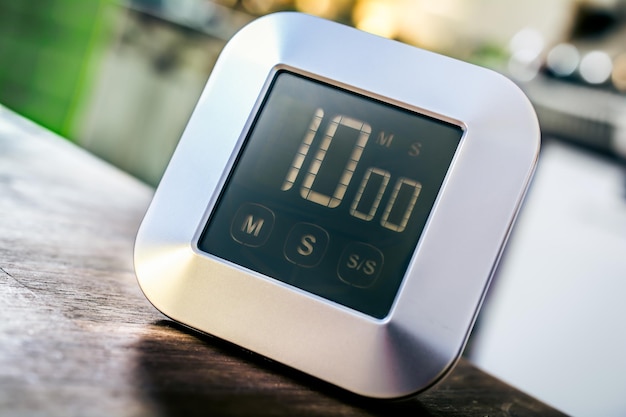 Close-up of digital clock on table