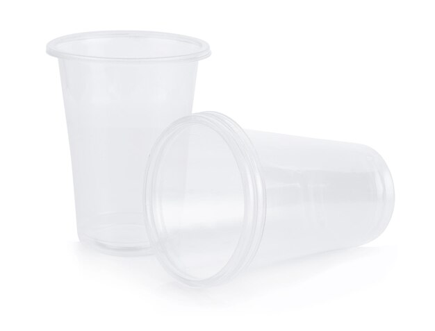 Photo close-up of disposable glasses on white background