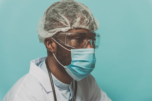close-up of doctor against colored background