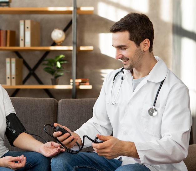 Close-up doctor checking patient