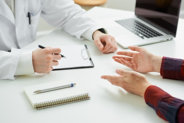 close up doctor explaining patient the results