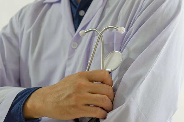 Close up of the doctor hand holding a medical stethoscope