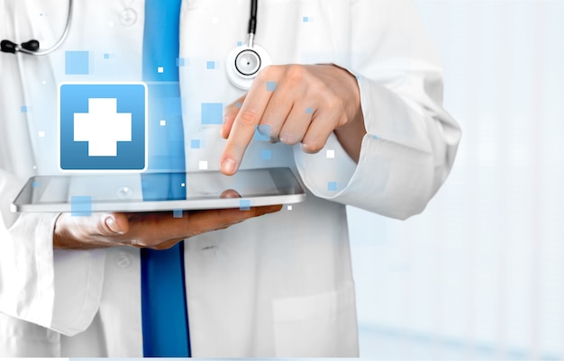 close-up doctor at hospital working with tablet pc