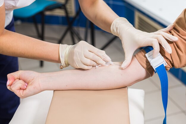 Close-up of doctor takes blood on the analysis.