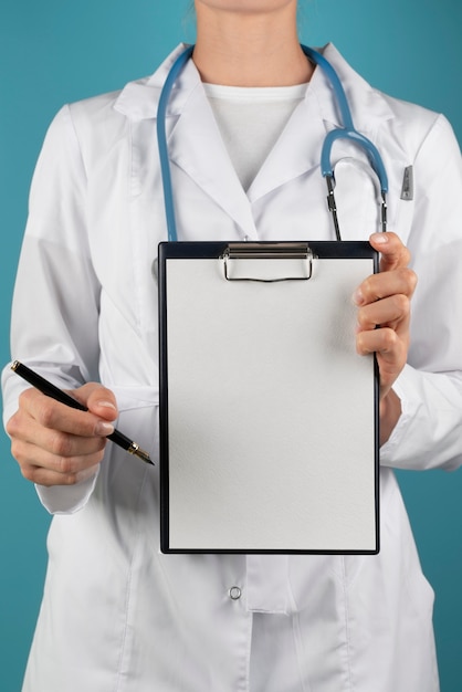 close up doctor with clipboard and pen