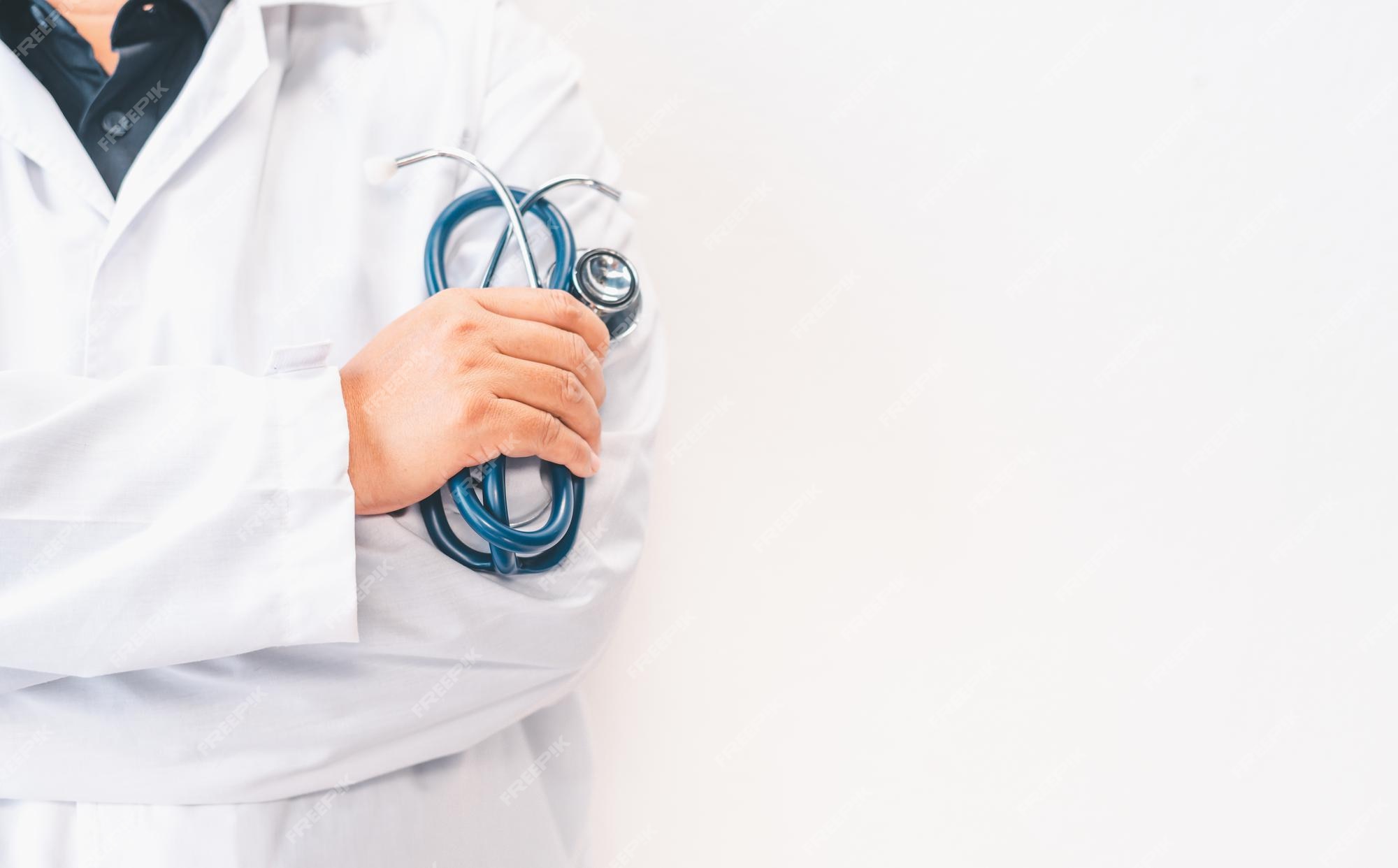 Premium Photo | Close-up of a doctor with a stethoscope on white background  copy space add a message. medicine and healthcare concept