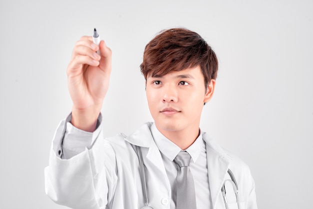 Close up of doctor writing something in the air with marker