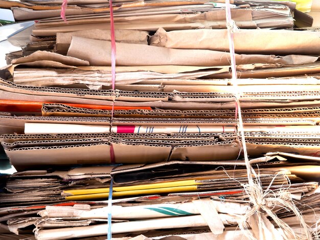 Close-up of documents stacked on table