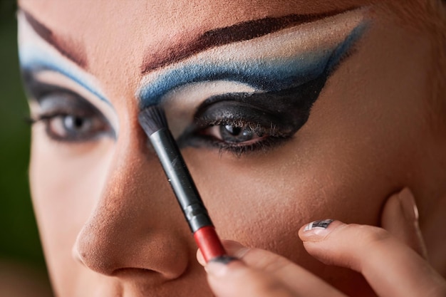 Close up of doing dramatic eye make up