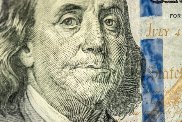 A close up of a dollar bill with the words " president " on it.