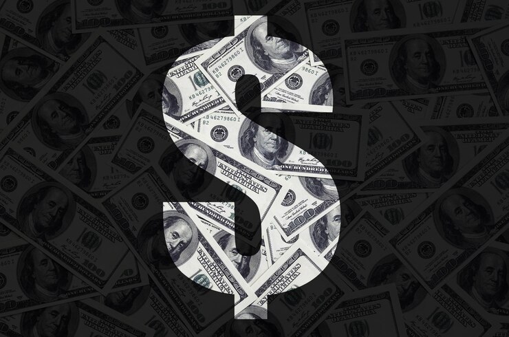 Photo close-up of dollar sign on paper currency