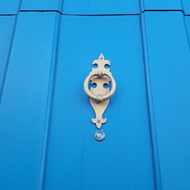 Close-up of door knocker on wall